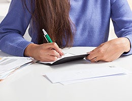 1. Pay your bill twice a month © Cheryl Savan/Shutterstock.com
