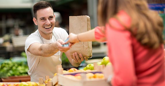 Substituting credit for cash | Lucky Business/Shutterstock.com