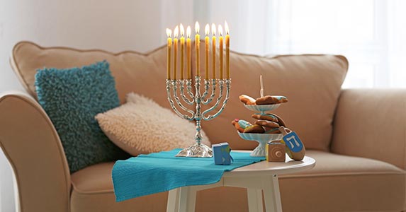 Create party ambiance with candles, scents | Africa Studio/Shutterstock.com