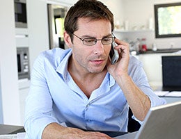 Should I get the loan locally or back home? © Goodluz/Shutterstock.com