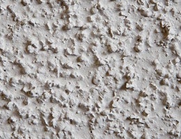 Popcorn acoustic ceilings © James L. Davidson/Shutterstock.com
