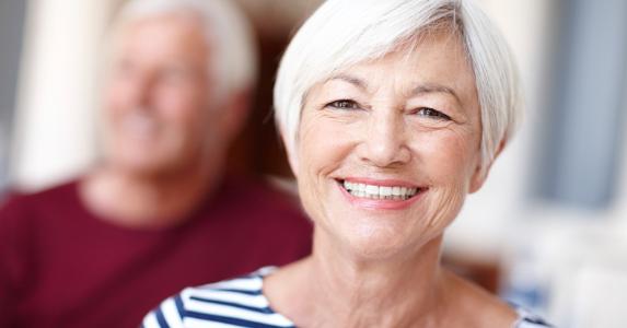 Senior woman smiling at camera © iStock