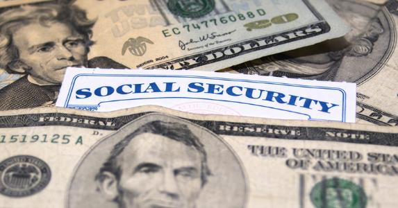 Social security card and money © iStock
