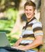 Student sitting under tree