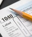 A 1040 form and a sharpened pencil 