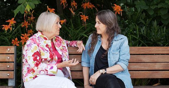 Americans' concerns about interest rates on the rise Two women sitting on a bench, talking | Allison Michael Orenstein/Getty Images