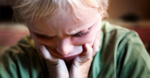 How to retire when you have an autistic child Upset boy wearing green shirt | RapidEye/Getty Images