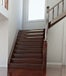 Vacant living room, hardwood floor with stairs 