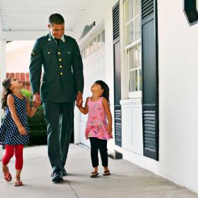 Veteran with his 2 children | Peathegee Inc/Blend Images/Getty Images