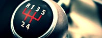 A close up of a black, white and red gear shift