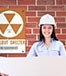 woman building plans fallout shelter sign