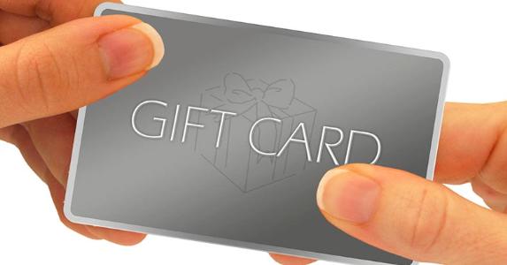 The best gift cards for every age Woman holding gift card © ARENA Creative/Shutterstock.com