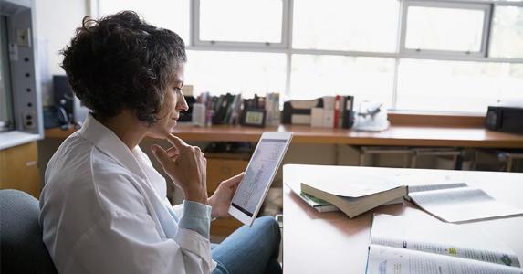 Can I get my $3K back from $30K 401(k) withdrawal? Woman looking at medical tablet | Hero Images/Getty Images