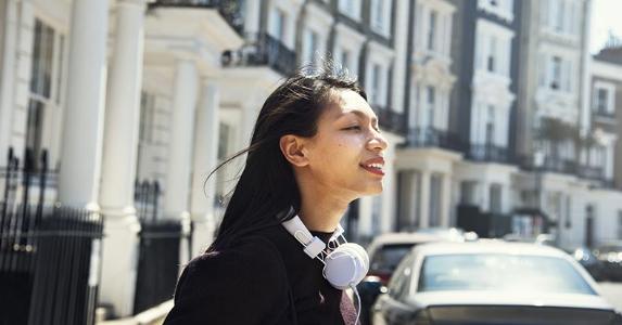 7 secrets to creating a budget Woman walking into street | Rawpixel.com/Shutterstock.com