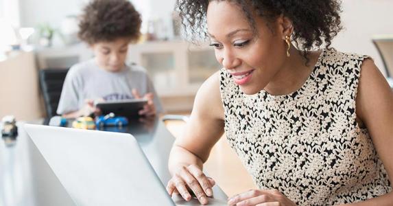 2016 tax deduction amounts Woman using laptop computer while son is playing on the background | Jose Luis Pelaez Inc/Getty Images