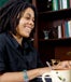 Ethnic woman sitting at her desk working from home