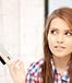 young brunette woman holding credit card