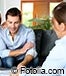 Young couple review paperwork broker
