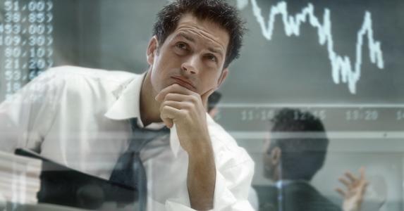 Investor analysing stock trends © iSTock