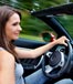 young woman driving sportscar