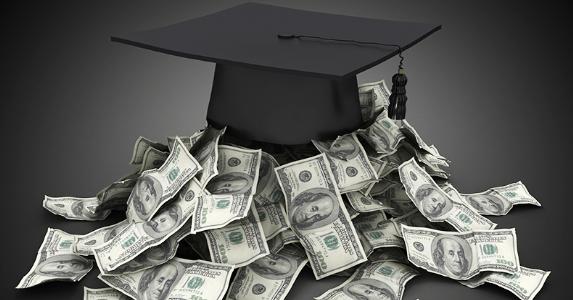 Graduation cap on top of pile of money